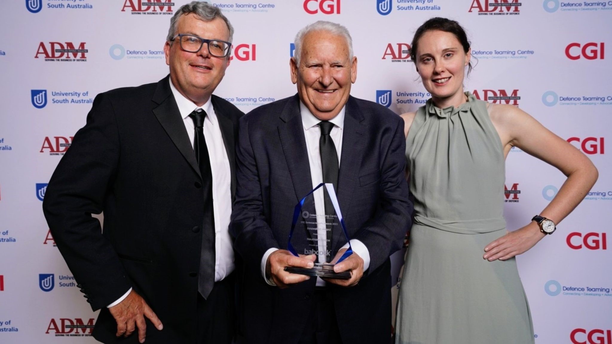 Andy Warr (Engineering Program Manager), Peter Schultz (Director & Executive Chairman), Giselle Stutzer (Electronics Engineer) with the Innovation Award Trophy